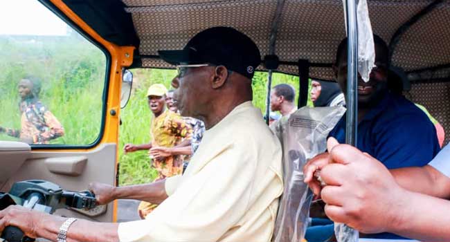Obasanjo Rides Tricycle, Picks Passengers In Abeokuta