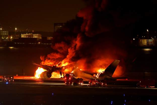 Japan Airlines jet bursts into flames after collision with earthquake relief plane at Tokyo Haneda airport
