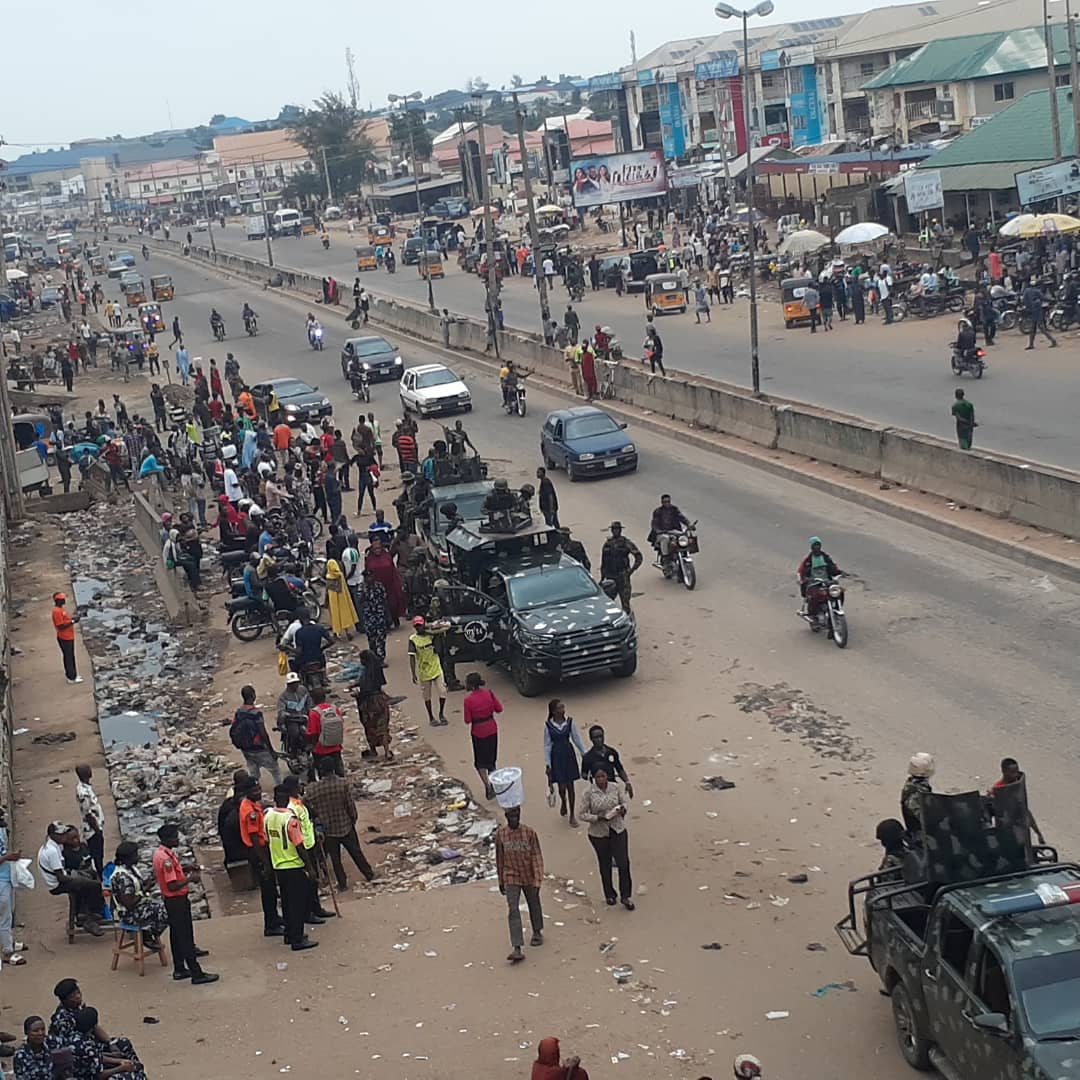 PHOTOS: Residents stranded, military on standby at major Abuja suburb