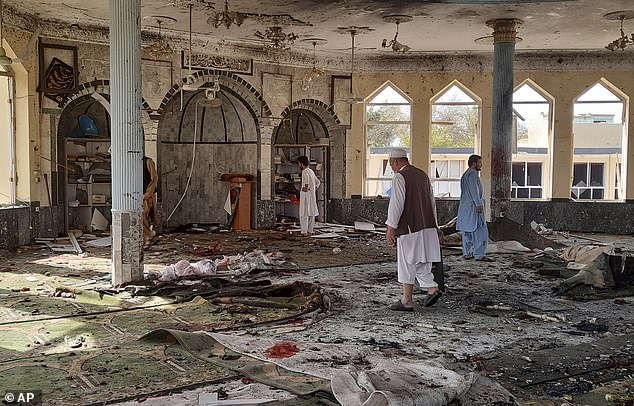 Suicide bomber kills at least 100 at Shi'ite mosque in northern Afghanistan after string of ISIS-K attacks as country descends further into chaos in wake of US withdrawal