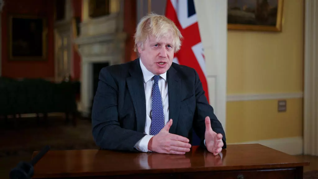 PM Johnson warns of "˜tidal wave' of Omicron as UK raises Covid-19 alert level