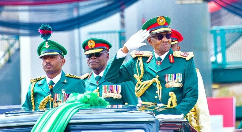 Buhari kits up in military uniform as he attends Army's presentation of new colours