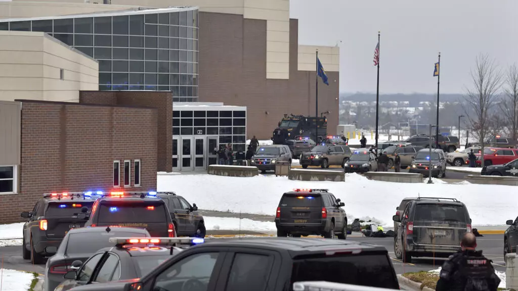 Teenage suspect in custody after deadly shooting at US high school