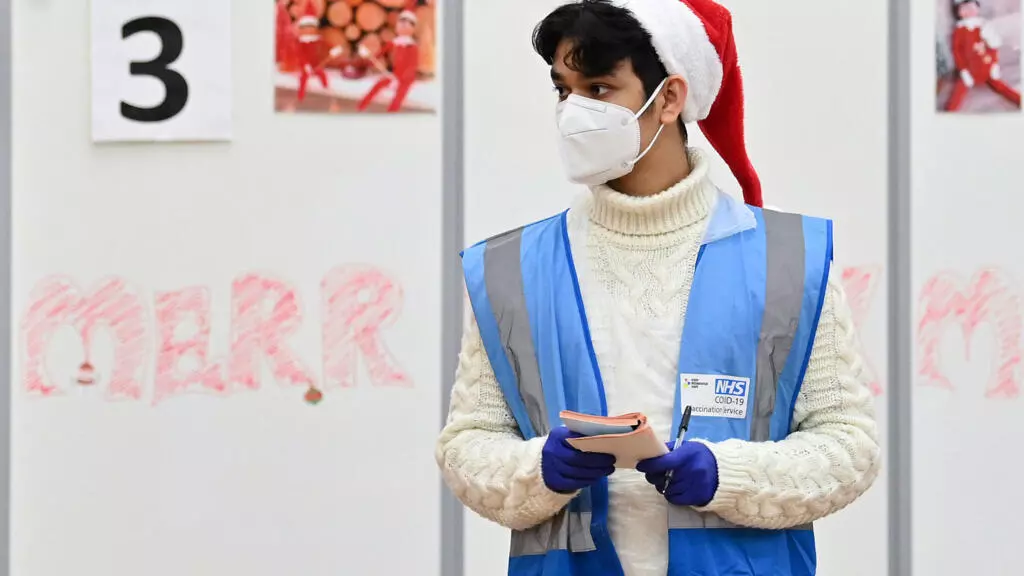 England vaccinates on Christmas Day as Omicron cases soar