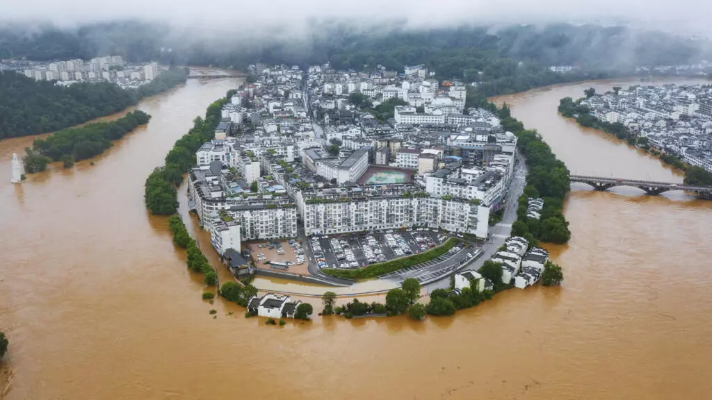 Hundreds of thousands evacuated in China after heaviest rains in decades